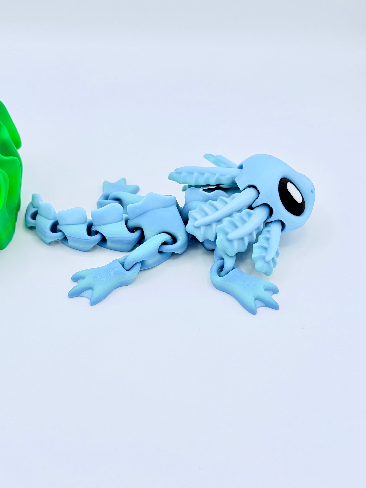 Axolotl with seaweed bed.