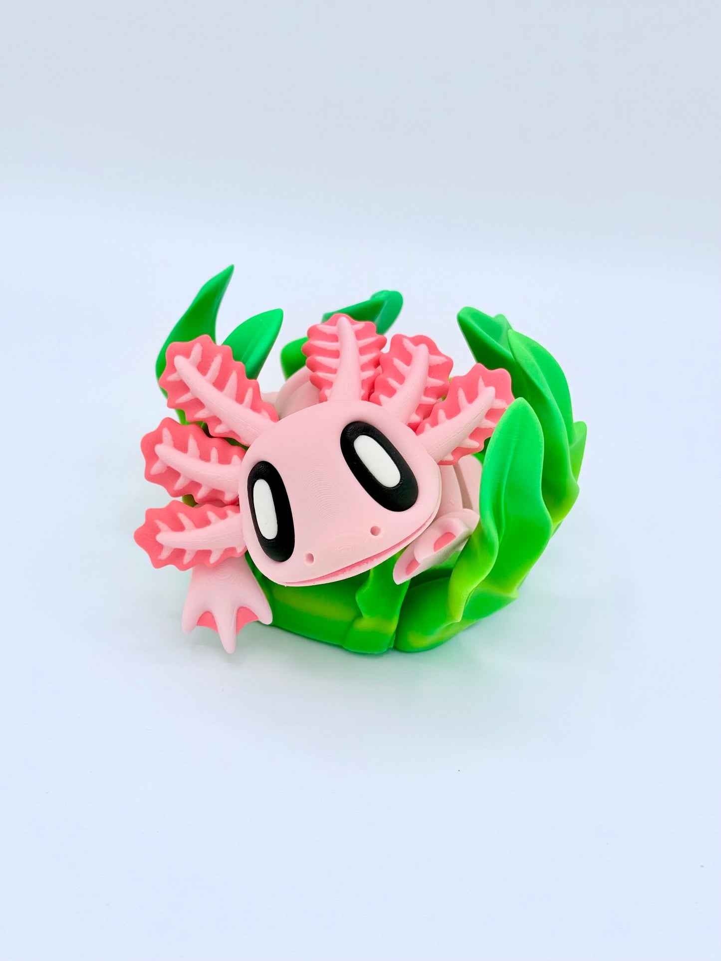 Axolotl with seaweed bed.