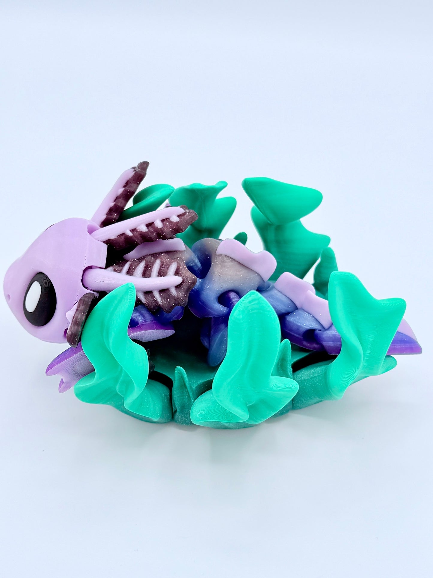 Axolotl with seaweed bed.