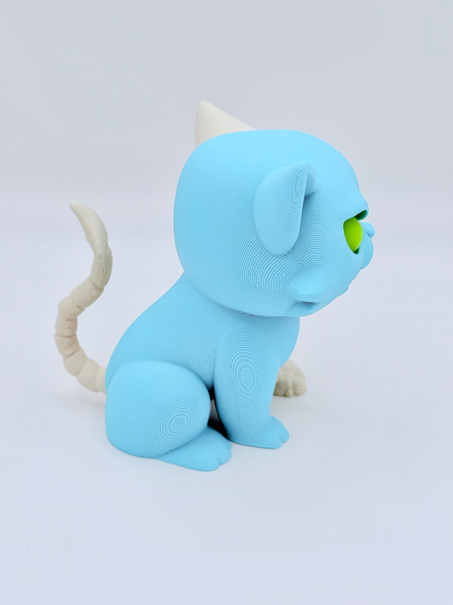 Cute devilish feline friend with Glow in the dark eye