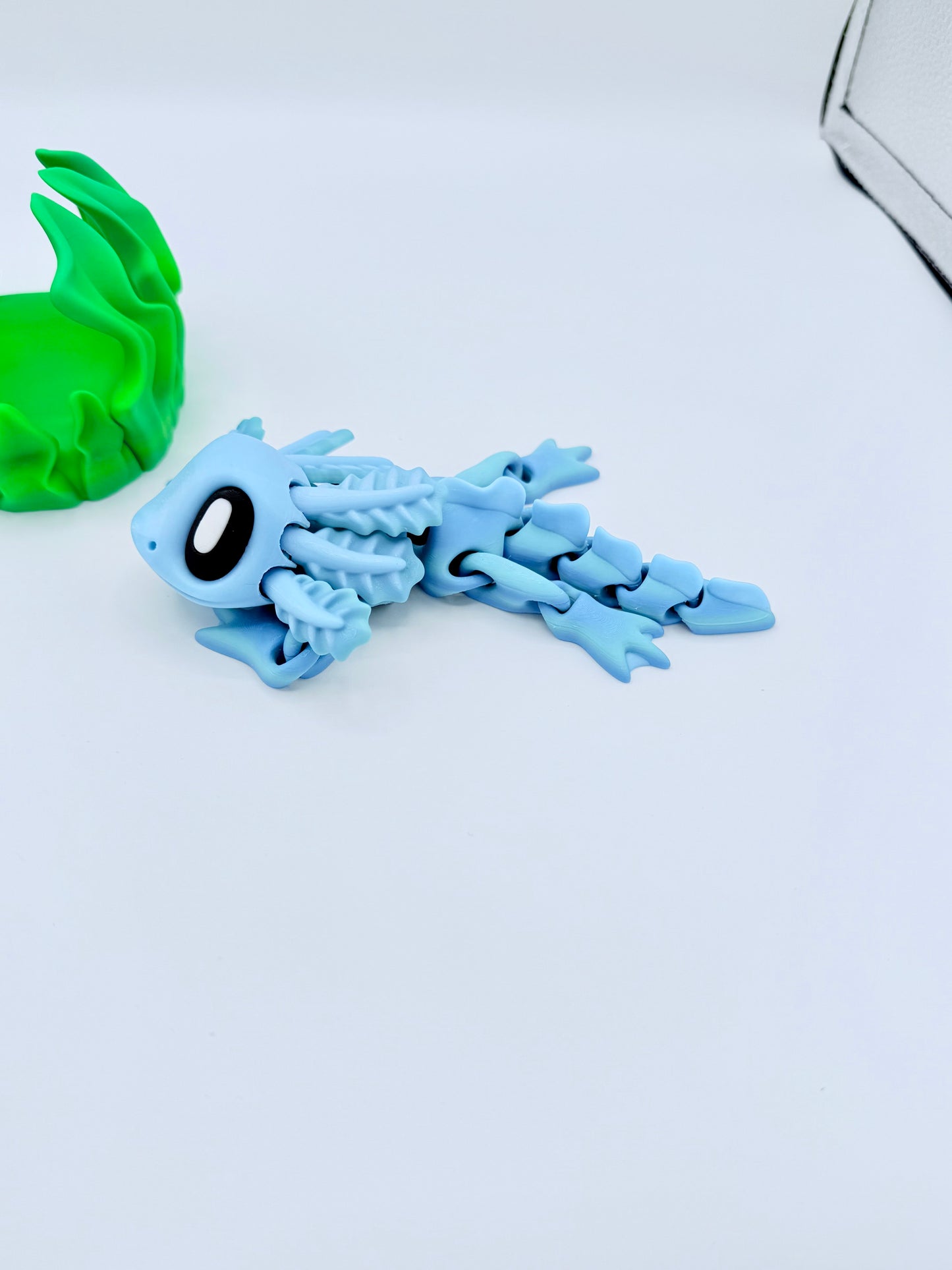 Axolotl with seaweed bed.