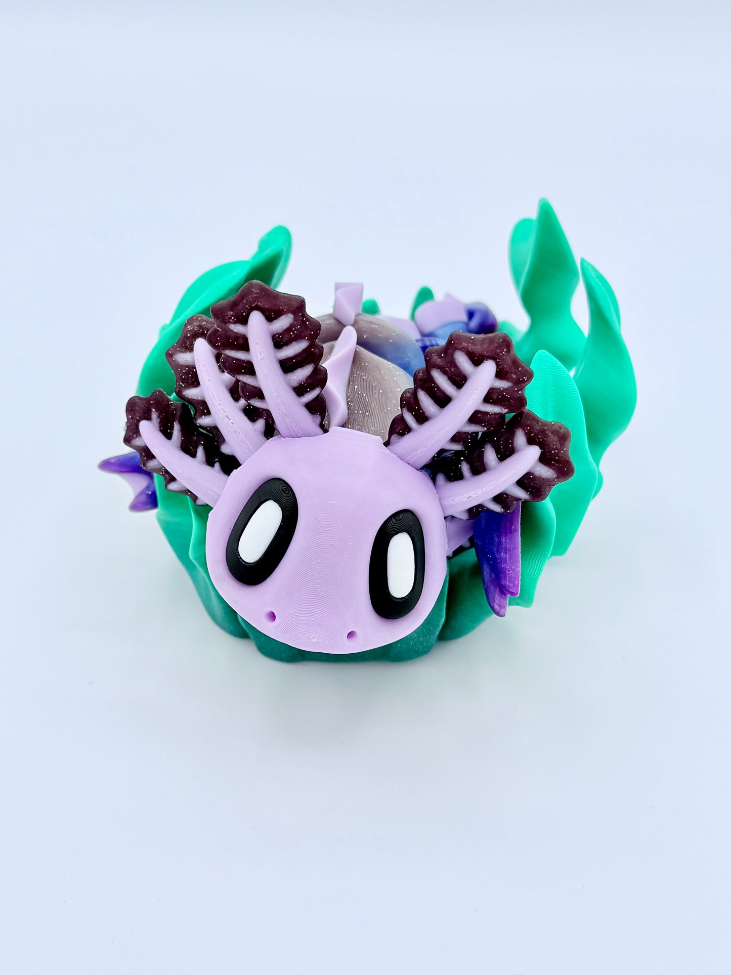 Axolotl with seaweed bed.