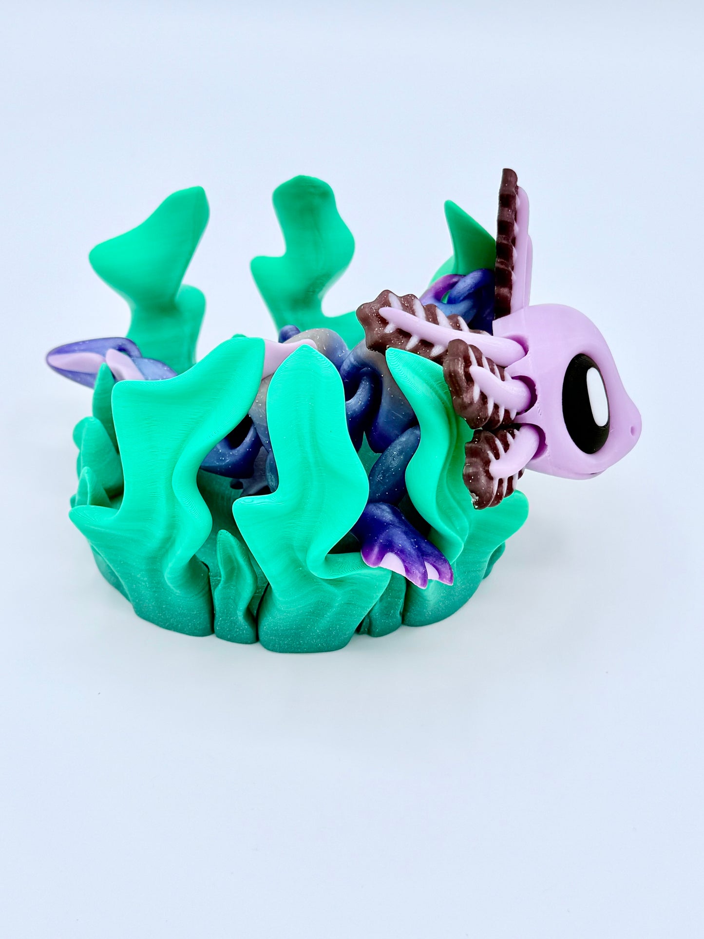 Axolotl with seaweed bed.