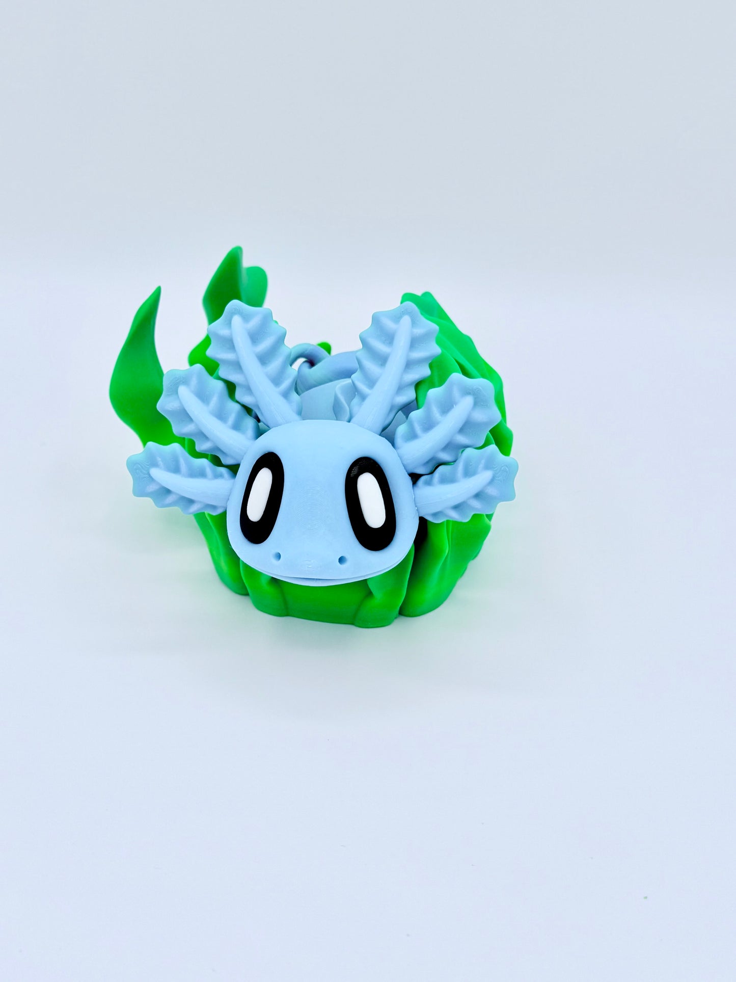 Axolotl with seaweed bed.