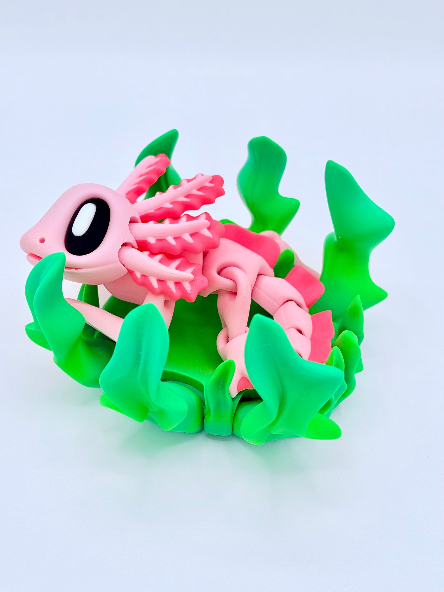 Axolotl with seaweed bed.