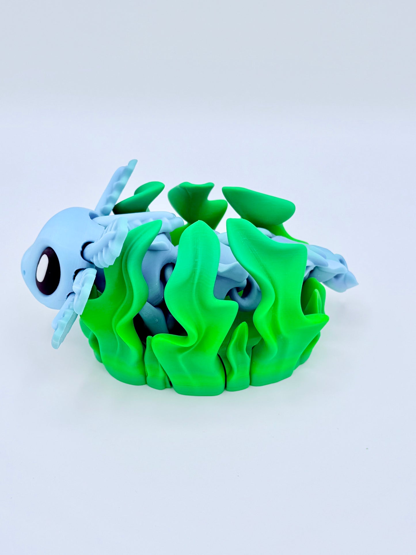 Axolotl with seaweed bed.